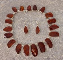 A suite of sterling silver and Baltic amber jewellery - all with naturalistically shaped polished