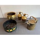 Five pieces of brass and other metalware: a pair of Edwardian brass pitchers by Henry Loveridge &