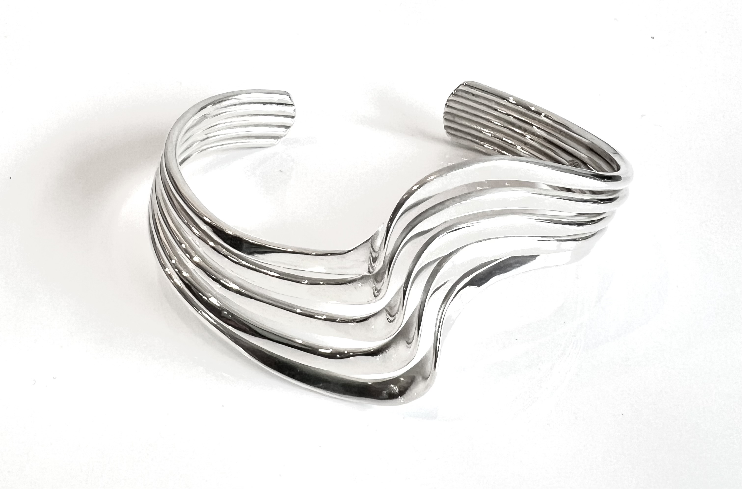 Three sterling silver modernist bangles of wavy form - one solid and the other two of pierced - Image 2 of 4