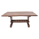 An elm refectory-style dining table - second half 20th century, the top with naturally shaped edge