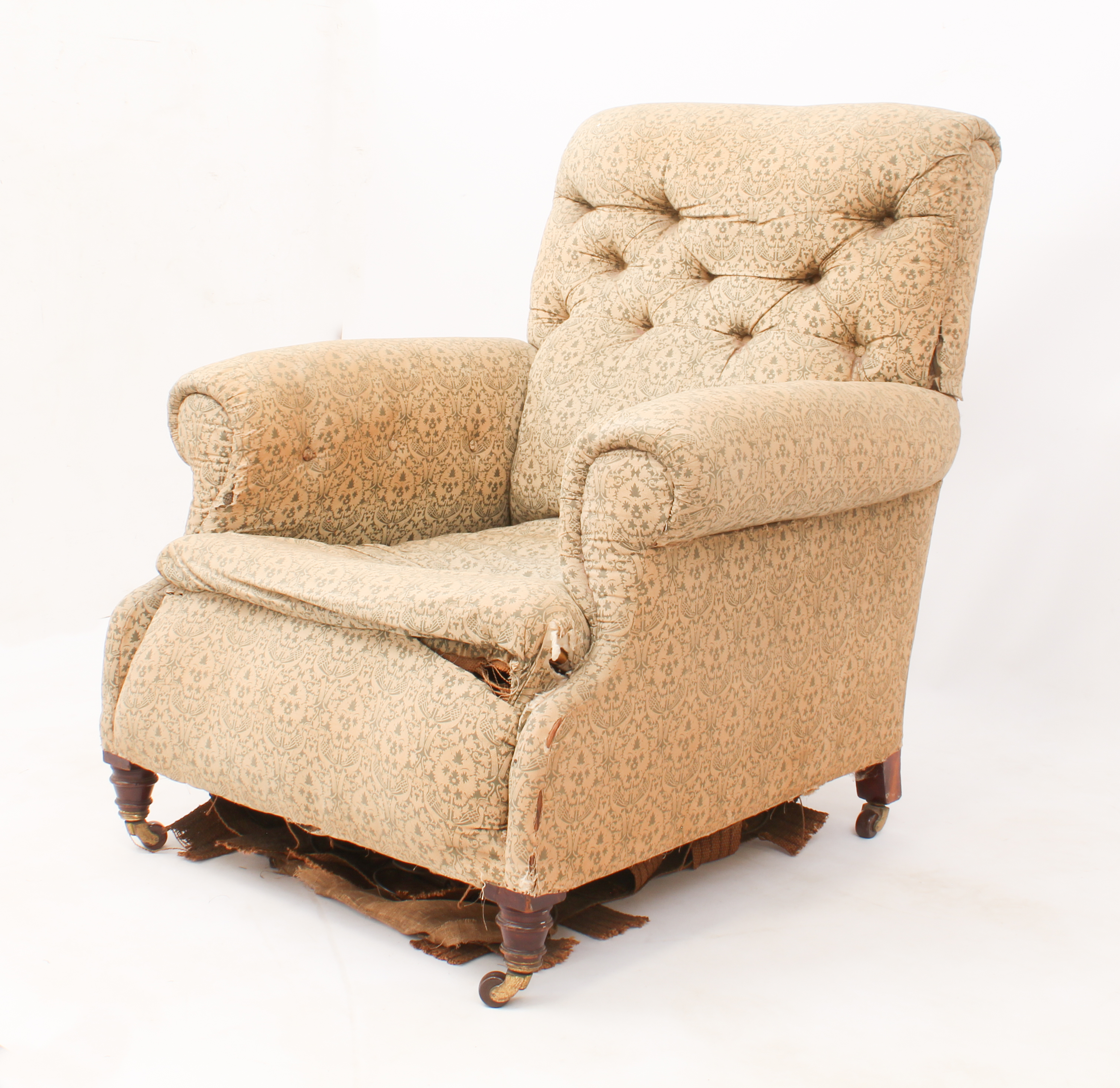 A late 19th / early 20th century Howard-style armchair by Hampton & Sons of London - in the original