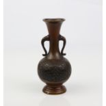 An early Oriental bronze vase.