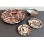 A modern Chinese porcelain supper set on a lazy Susan base - the five serving dishes with Imari