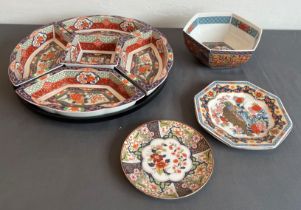 A modern Chinese porcelain supper set on a lazy Susan base - the five serving dishes with Imari