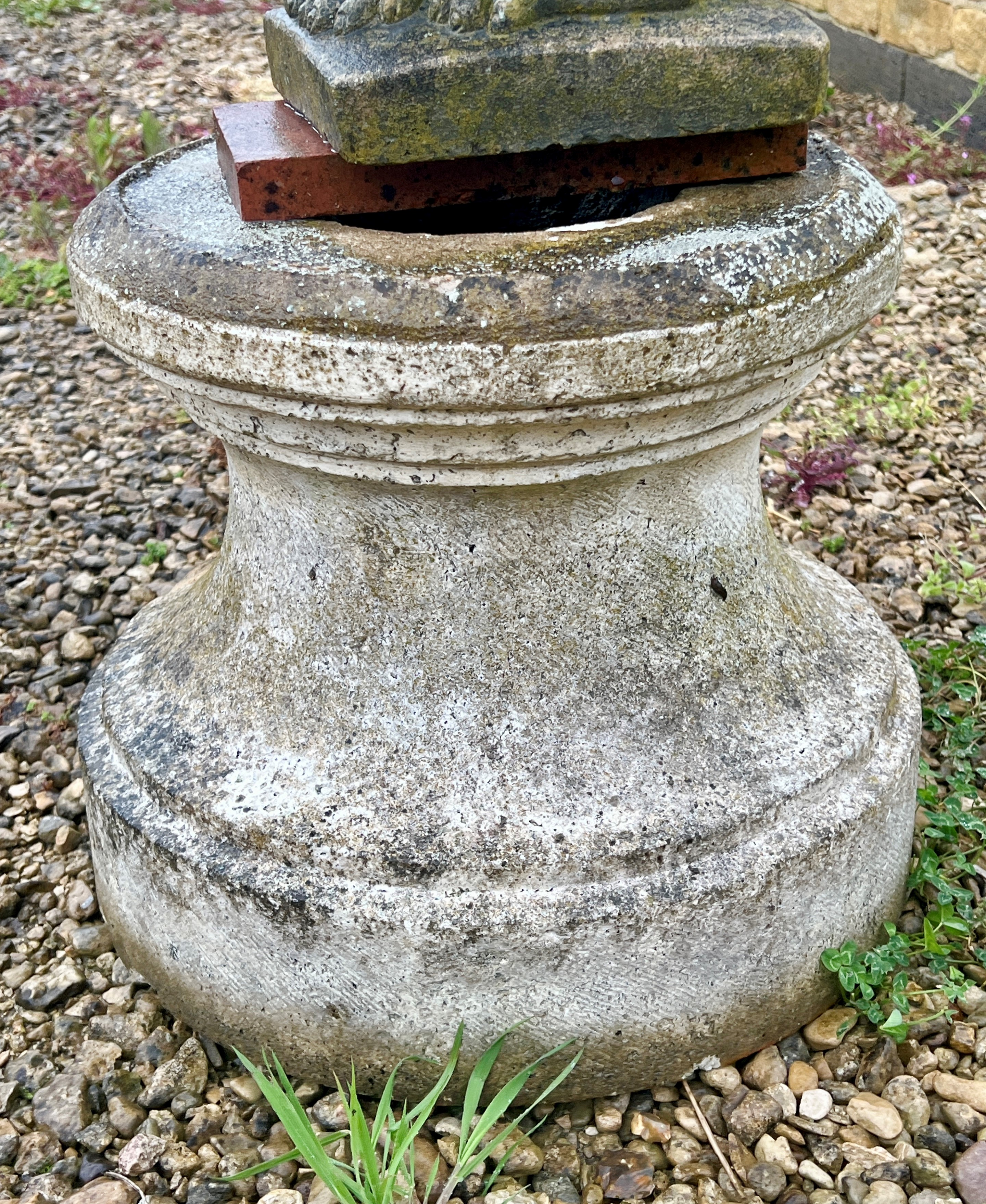 A composite stone garden planter base or pedestal - of fluted column form, 46cm diameter x 38cm