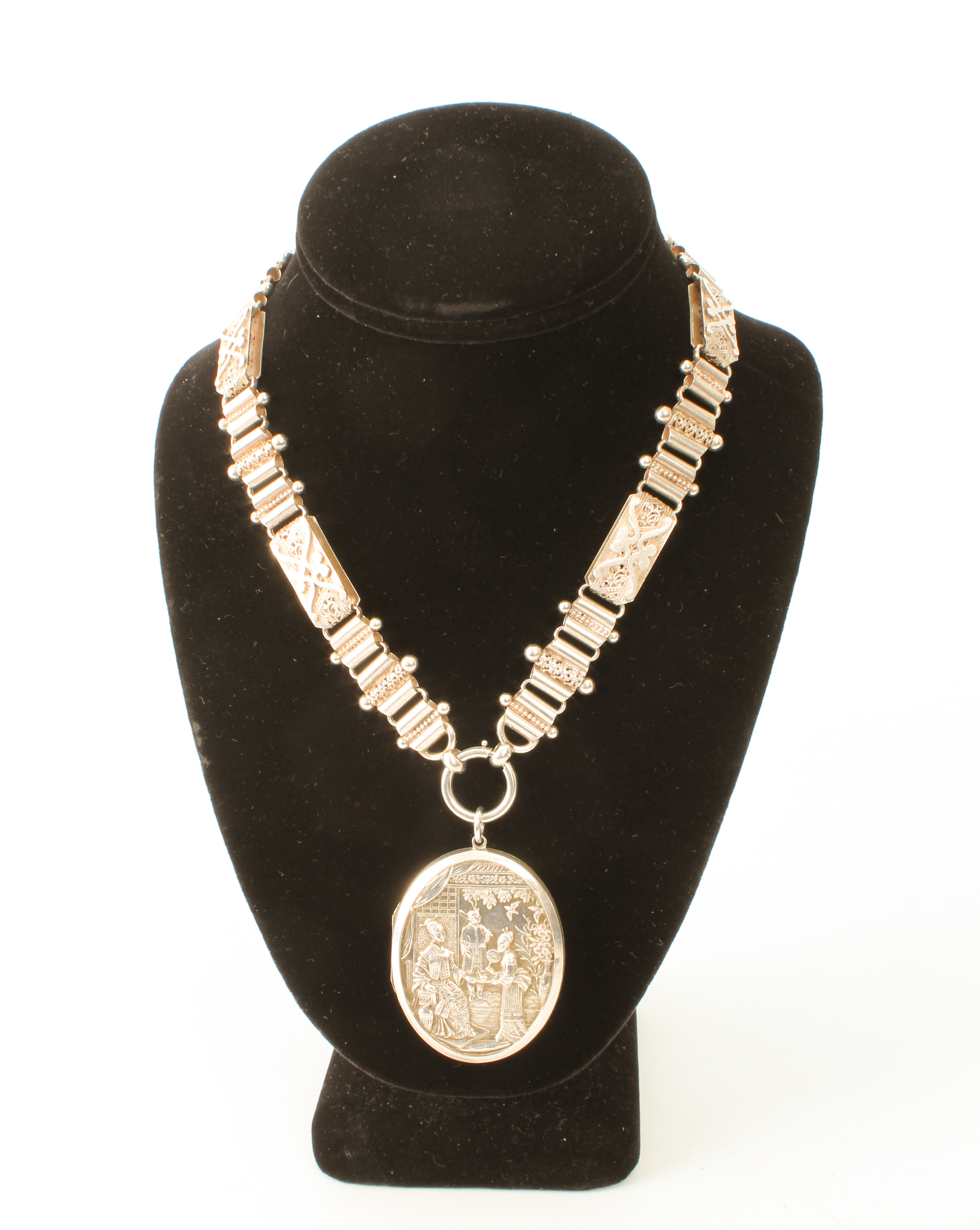 An early 20th century sterling silver necklace with silver-plated pendant locket - the pendant 50