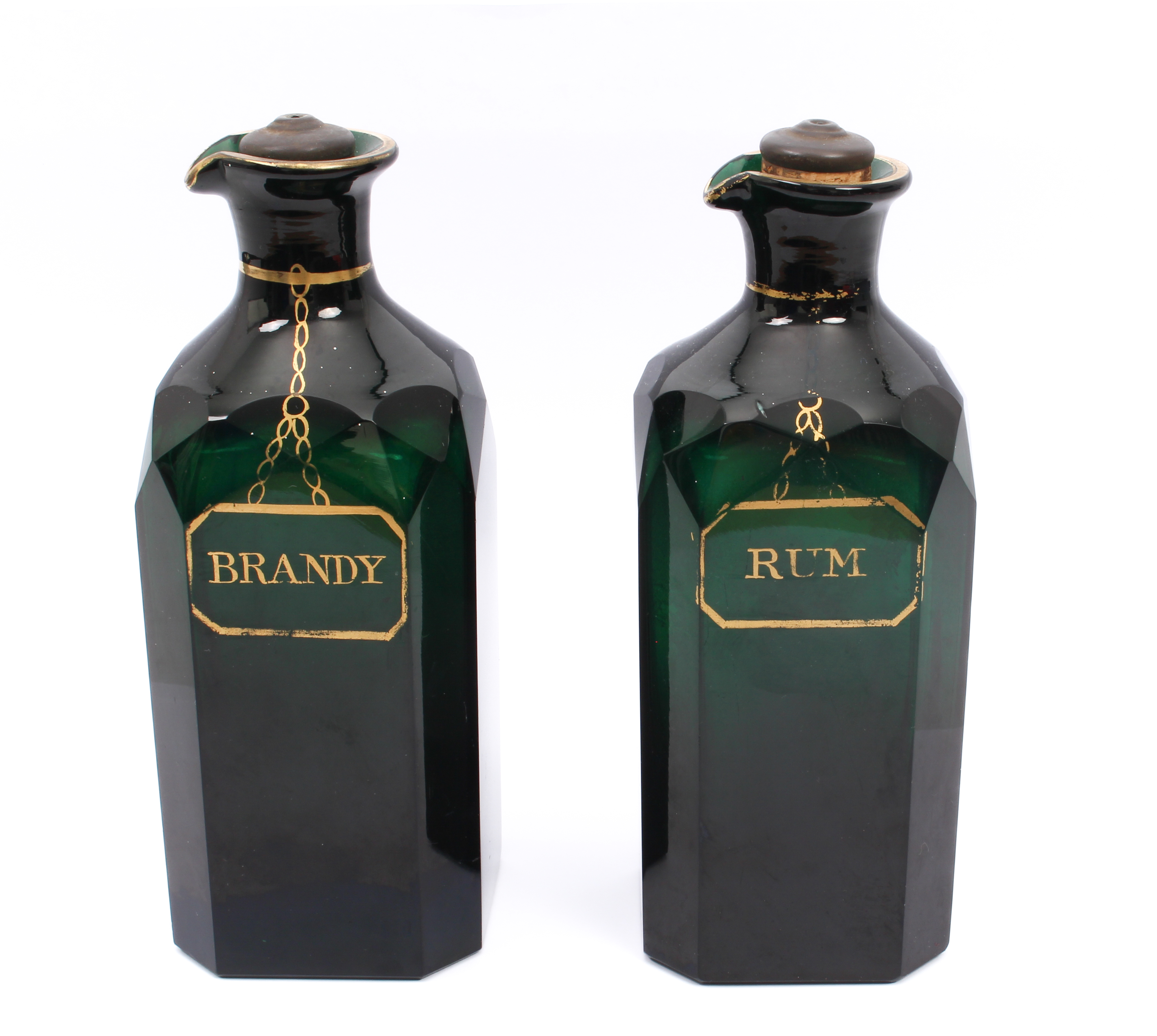 A pair of Georgian Bristol green glass and gilt spirit decanters - of square form with clipped