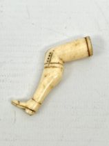 An early 19th century prisoner of war carved-bone novelty pipe-tamper - in the form of a shapely