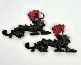 A pair of antique cast iron and bronze Chinese style dragons - possibly originally from a pair of