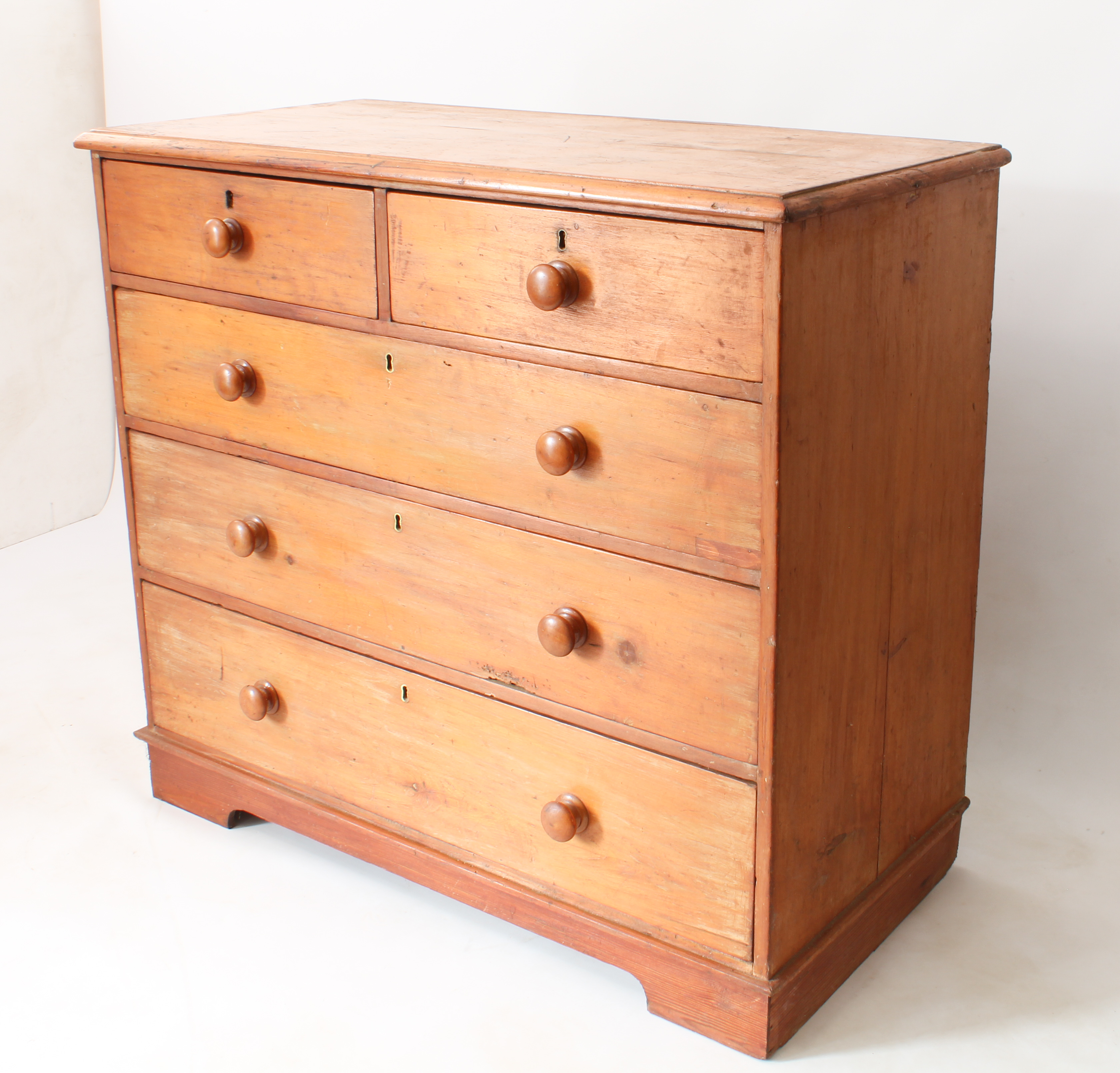 A Victorian pine chest of drawers - the moulded top over two short and three long graduated drawers, - Image 2 of 3