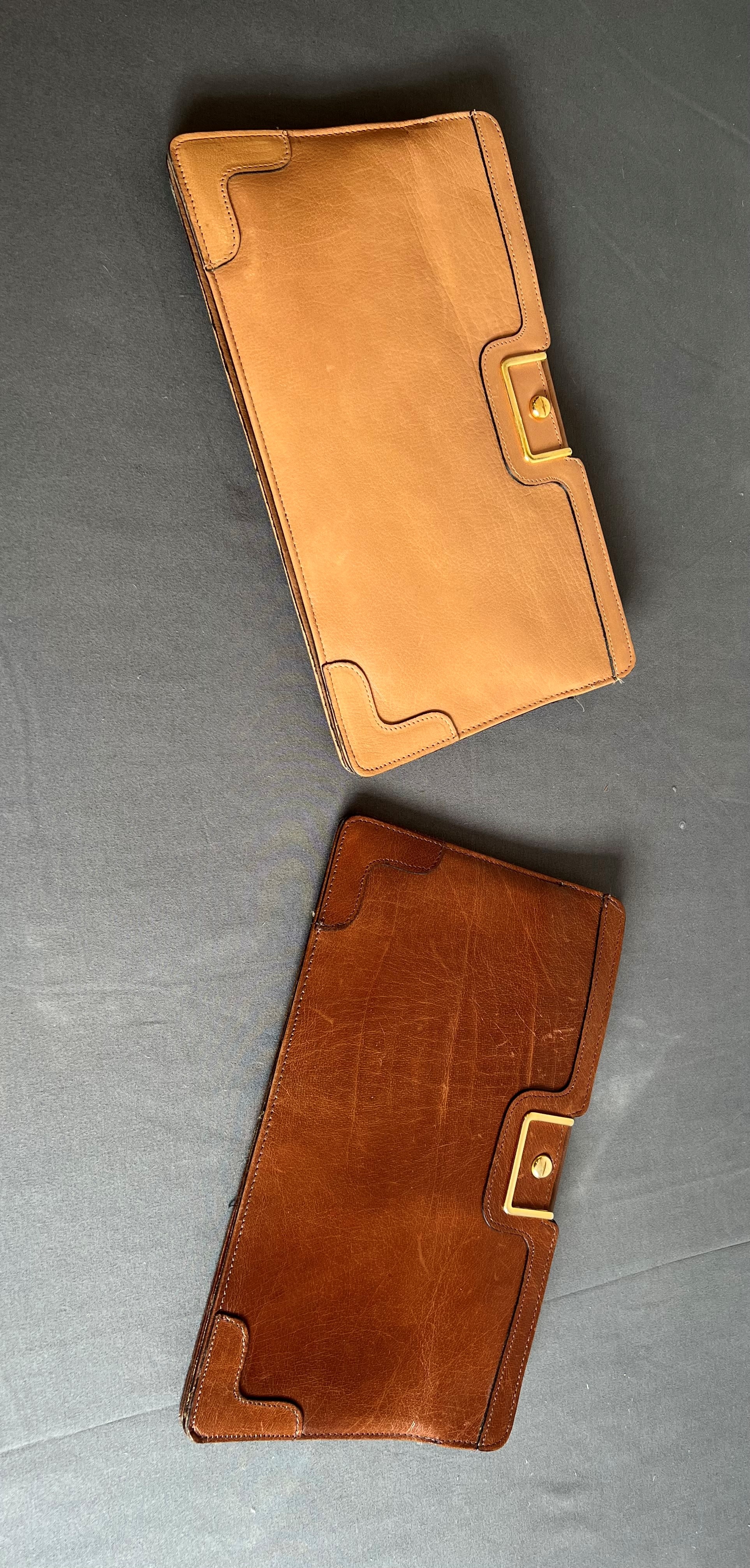 Two vintage Elgee clutch bags, 1960s-70s - one in tan leather, the other in pale tan leather, with