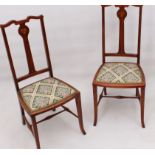 A pair of Edwardian Art Nouveau style inlaid beech wood bedroom chairs - the backs with floral