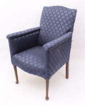 A late 19th century armchair - the serpentine back over roll-top arms, upholstered in dark-blue