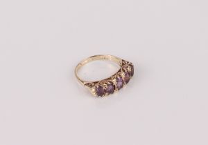 A 9ct gold and amethyst five stone Victorian-style ring - hallmarked London 1973, with five