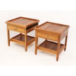 A pair of modern hardwood bedside tables - the square tray top over a frieze drawer and tray