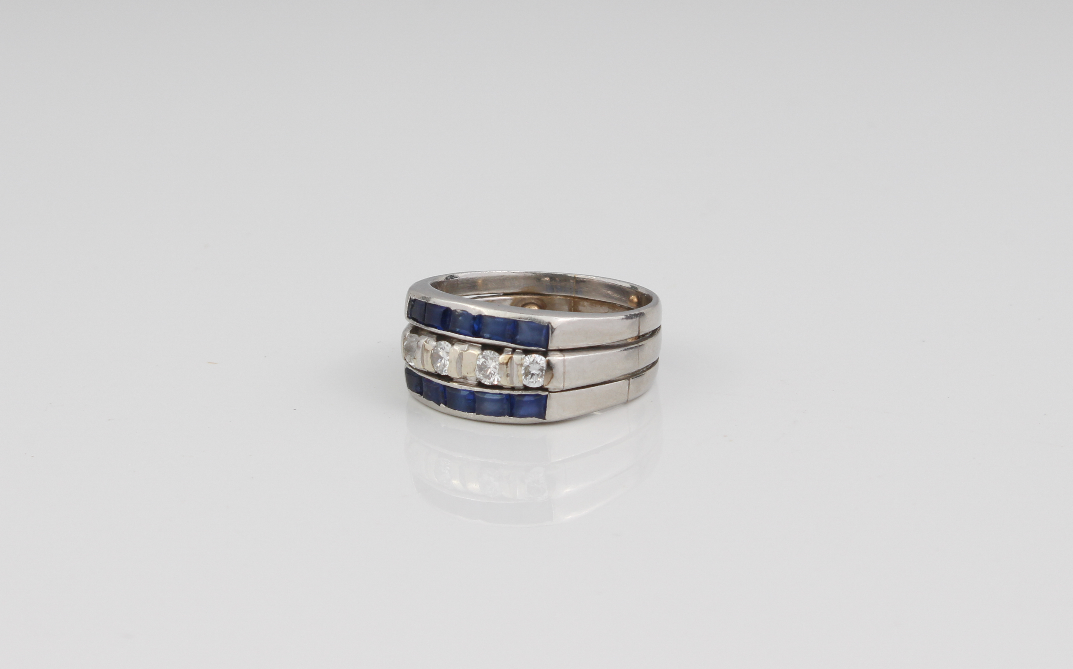 A platinum, sapphire and diamond three-row ring - unmarked, tested as platinum, the central row of - Image 4 of 4