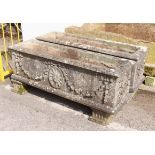 A pair of large rectangular composite stone troughs or planters - well weathered, decorated with