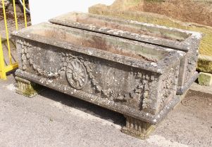 A pair of large rectangular composite stone troughs or planters - well weathered, decorated with