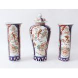 A garniture of three Japanese porcelain Imari decorated vases - early 20th century, comprising a