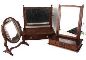 Three mahogany toilet mirrors - one early 19th century, with a rectangular plate within reeded