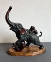 A Japanese bronze figure of an elephant and two tigers in battle after Genryusai Seiya - mid-20th