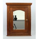 A small mahogany hanging corner cupboard - 2nd half 20th century, with bevelled mirrored door and