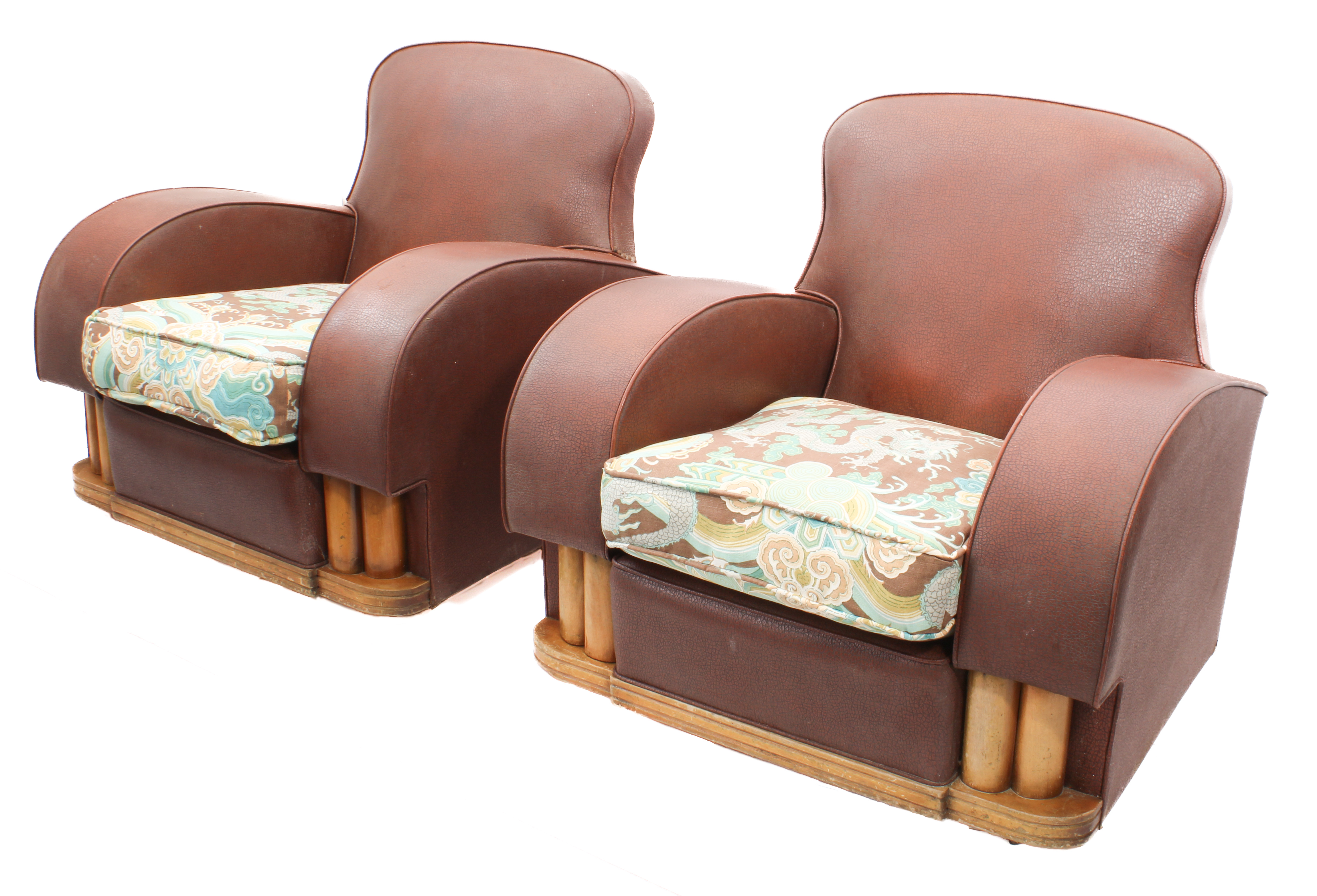 A pair of mid-century Art Deco style armchairs - upholstered in brick red faux-leather, with later