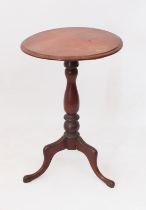 A mid-19th century mahogany tripod table - the moulded circular top on a turned baluster column,