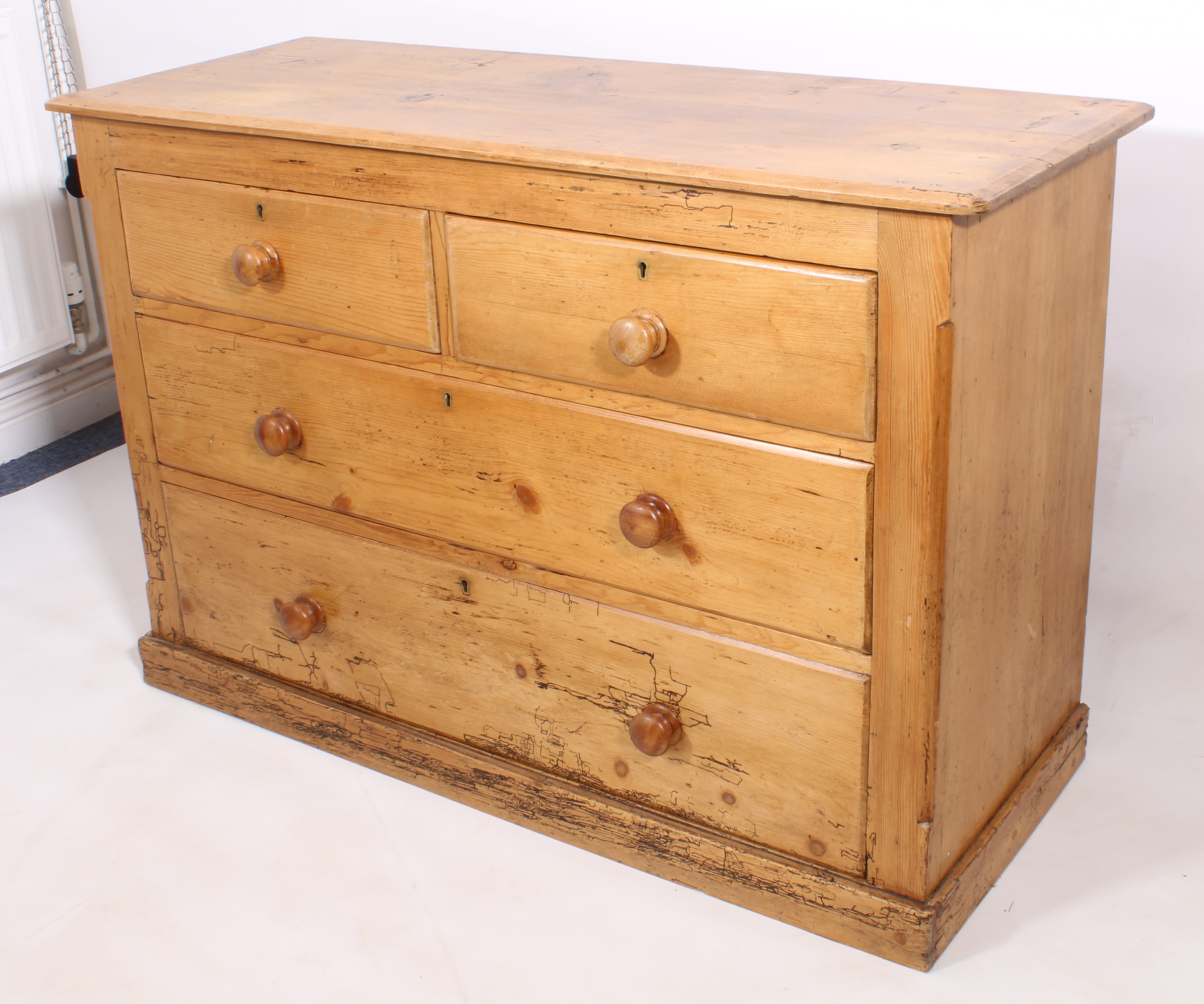 A late-19th century waxed pine chest of drawers - the bevelled top over two short and two long - Image 2 of 3