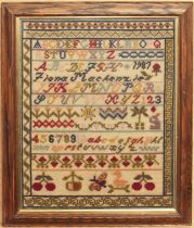 A 20th century sampler - inscribed 'Fiona Mackenzie 1987', with alphabet and numerical panels over