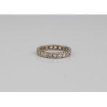 A 9ct white gold full eternity ring - hallmarked London 2004, with 21 round cut white stones, size