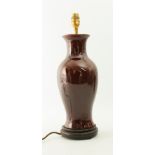 A Chinese-style flambé glaze porcelain vase lamp - of baluster form, in a deep, red-brown glaze,
