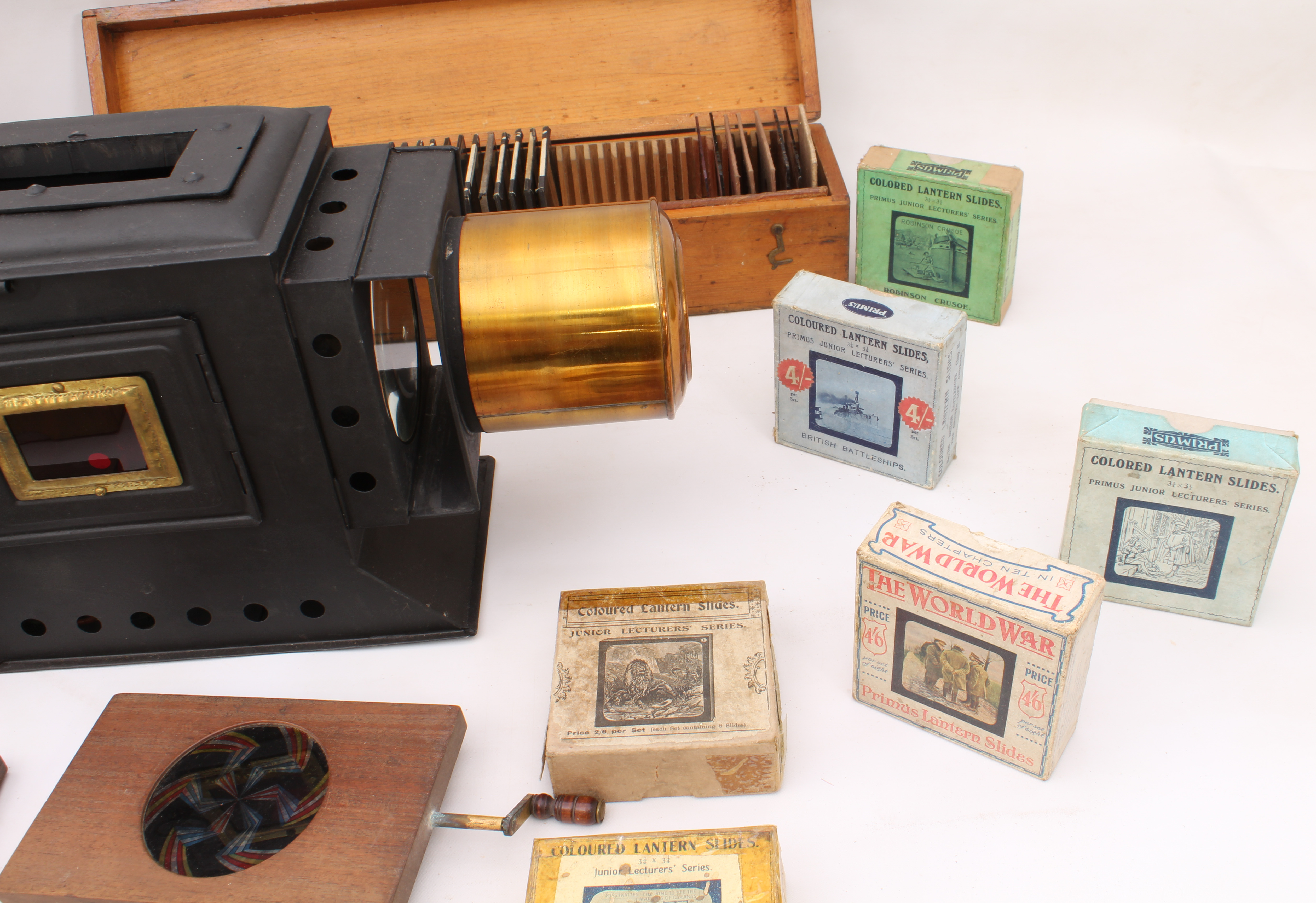 A cased magic lantern and a good quantity of slides to include: a mahogany and gilt-brass hand- - Image 14 of 14