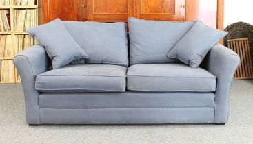 A Barker and Stonehouse 'Berkeley' three-seater sofa - circa 2022, in plain blue upholstery, on