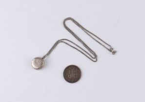 A 1948 George VI sixpence pendant, on a silver curb link chain - together with an 1887 Queen