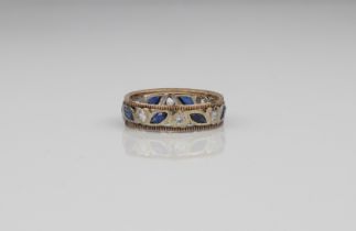 A 9ct gold two-colour sapphire eternity ring - London hallmarks, with alternate round cut white