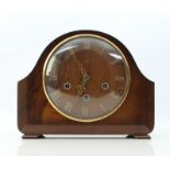 A walnut-cased Smiths mantel clock - 1940 or 1950s, the walnut dial with applied brass Roman