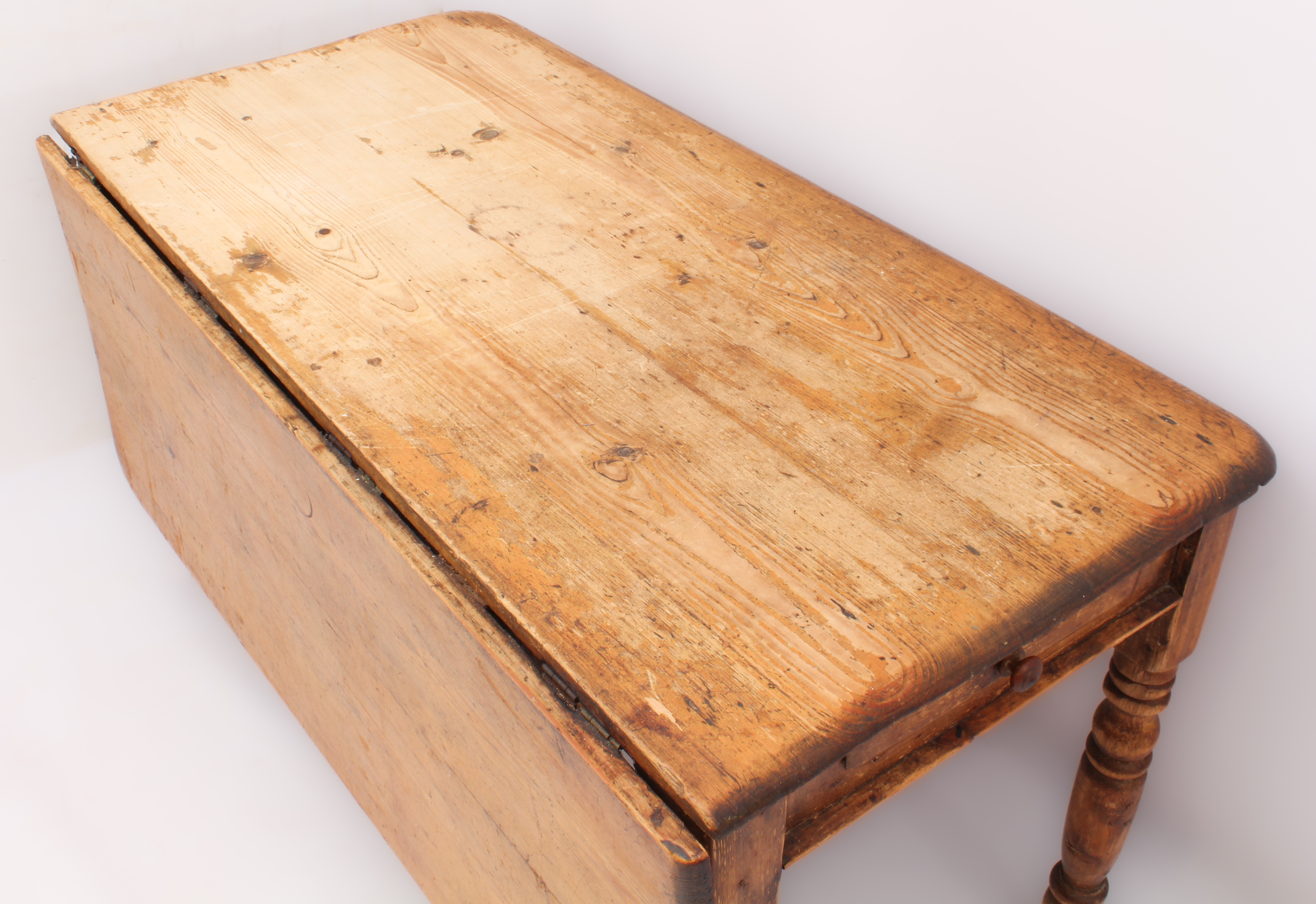 A 19th century pine farmhouse dining table with single dropflap - the rectangular top over two end- - Image 2 of 3