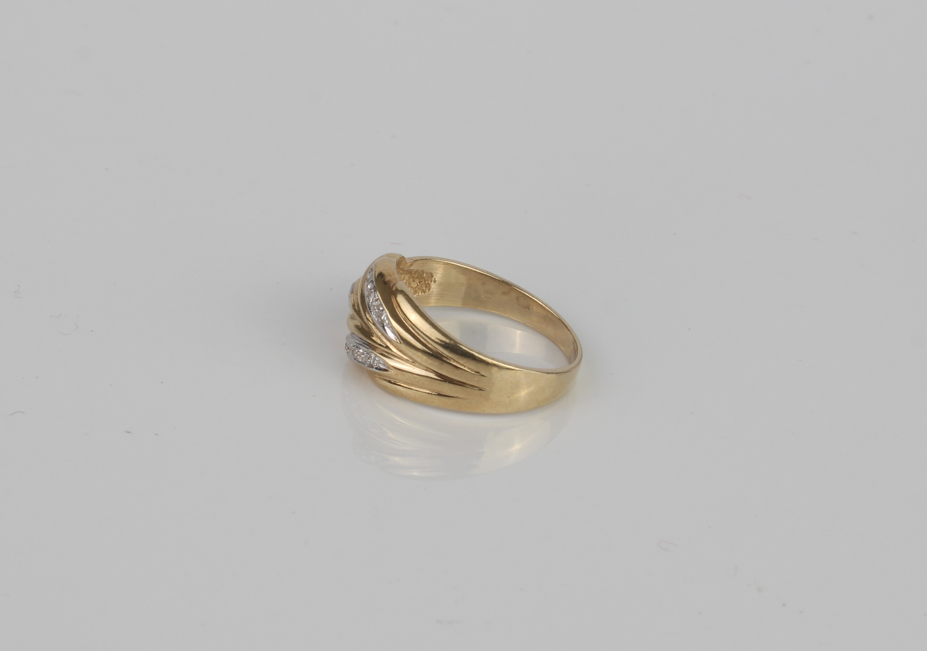 A 9ct gold and diamond ring - hallmarked Sheffield 1994, the foliate two-colour setting accented - Image 3 of 4