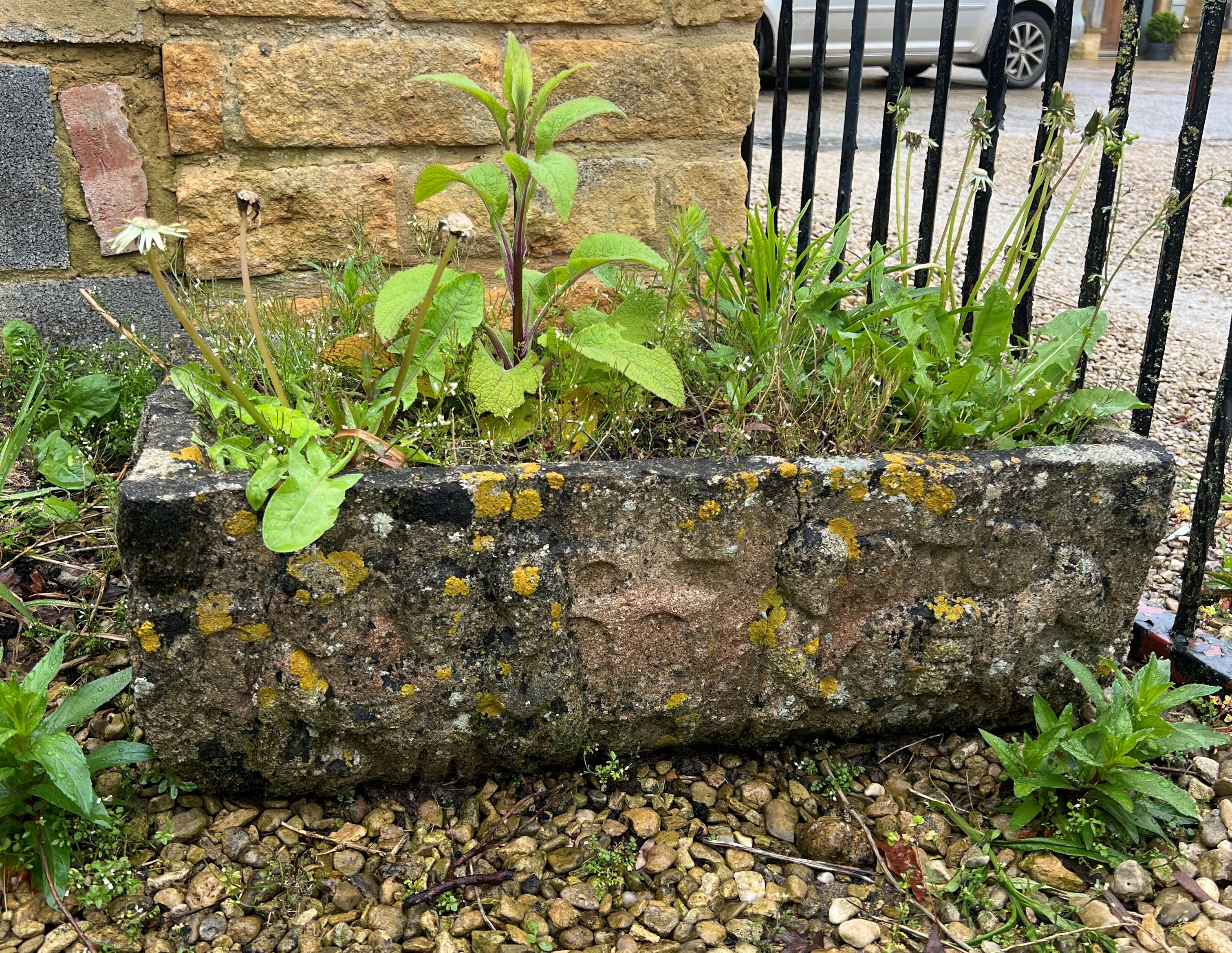 A composite stone rectangular trough - decorated with a figural frieze, 70 x 35cm x 23cm high.