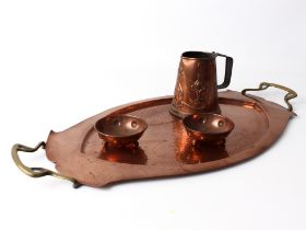 Four pieces of Arts & Crafts copper ware - all early 20th century, comprising a planished copper and