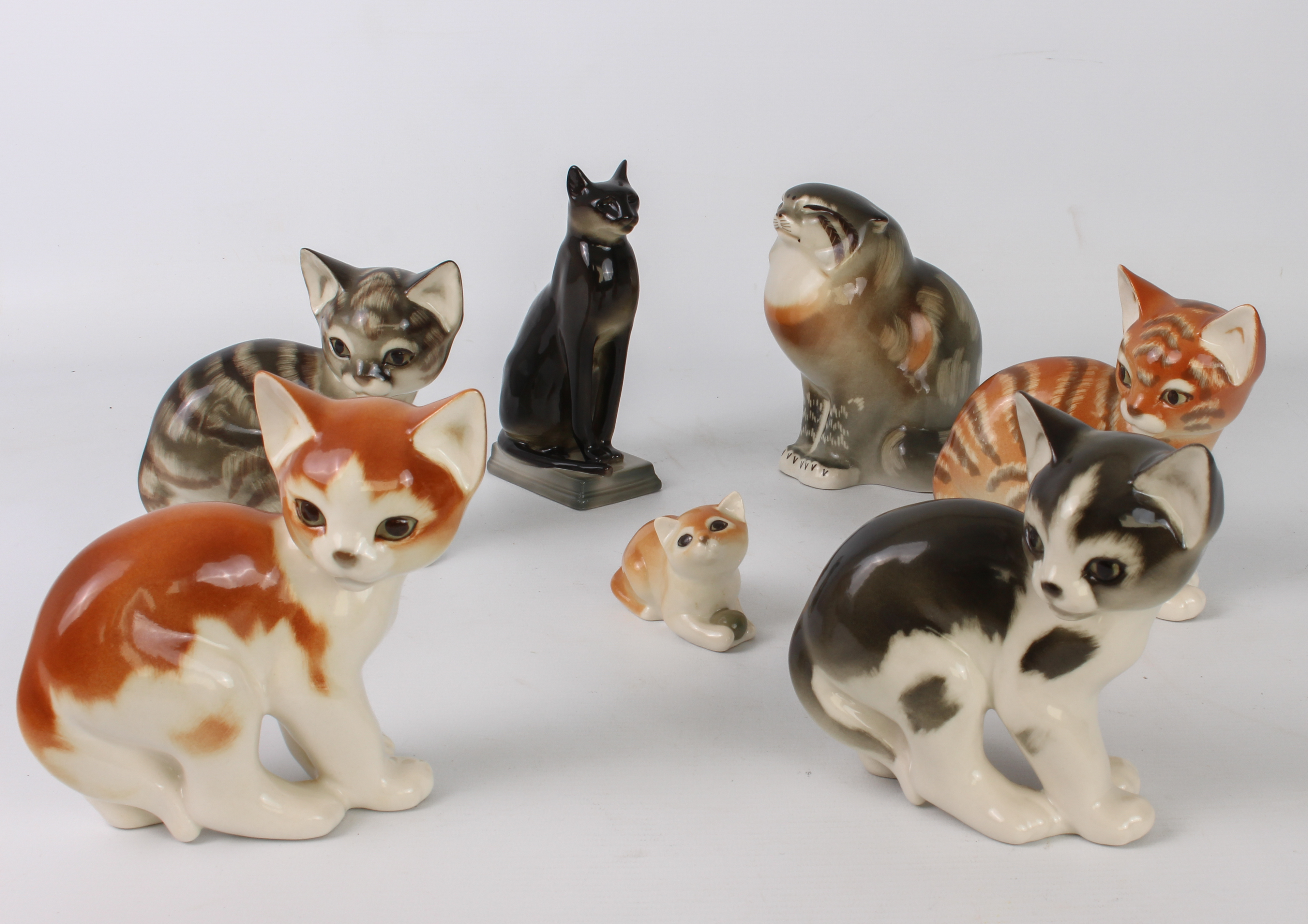 A group of seven Russian china figures of Cats by Lomonosov Porcelain - the largest 16 cm high.