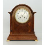 An English oak cased mantel clock - circa 1910, the 5in. white Arabic dial fronting a Samuel Marti