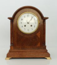 An English oak cased mantel clock - circa 1910, the 5in. white Arabic dial fronting a Samuel Marti