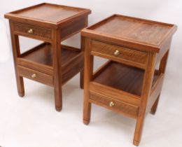 A pair of modern hardwood bedside tables - the square tray top and undertier each with a frieze