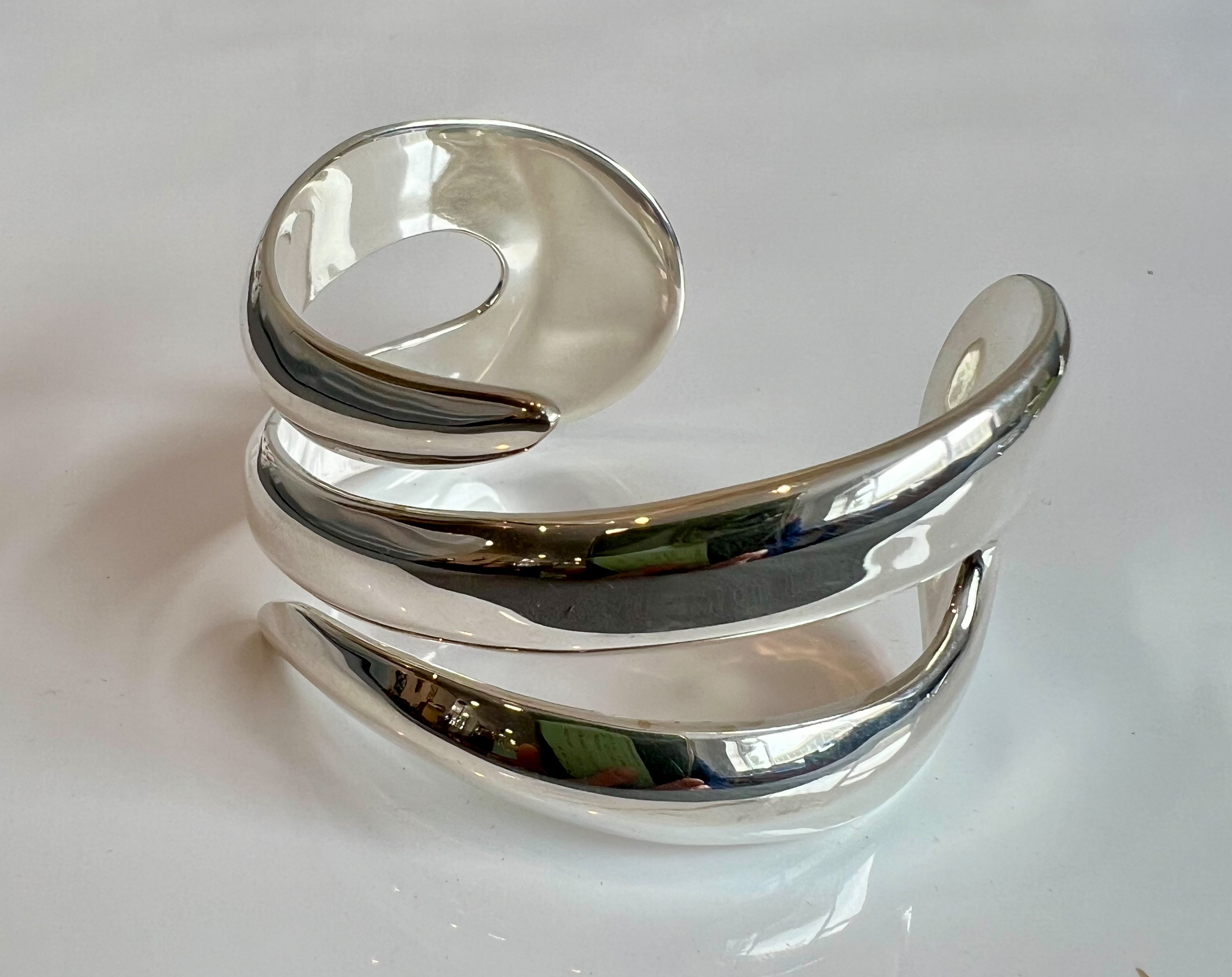 Three modernist sterling silver bangles - each stamped 925, comprising a bark effect cuff bangle, - Image 3 of 4