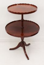 A reproduction Georgian-style mahogany two-tier dumb waiter - the two graduated circular tiers