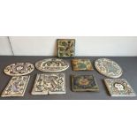 A collection of nine Persian glazed tiles - some antique, including three oval tiles, one 30 cm tile