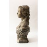 A large bronzed plaster classical bust of a lady - in a draped robe decorated with roses, on an