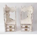 A pair of shabby chic painted mahogany hanging corner shelves - each with two drawers with gilt